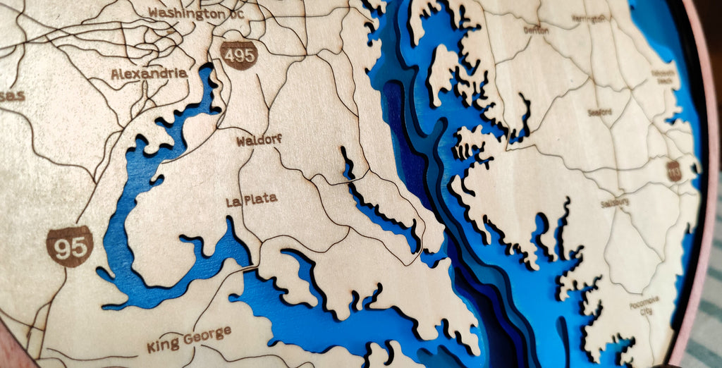 Close-up of a wooden map plaque featuring the Washington, D.C.